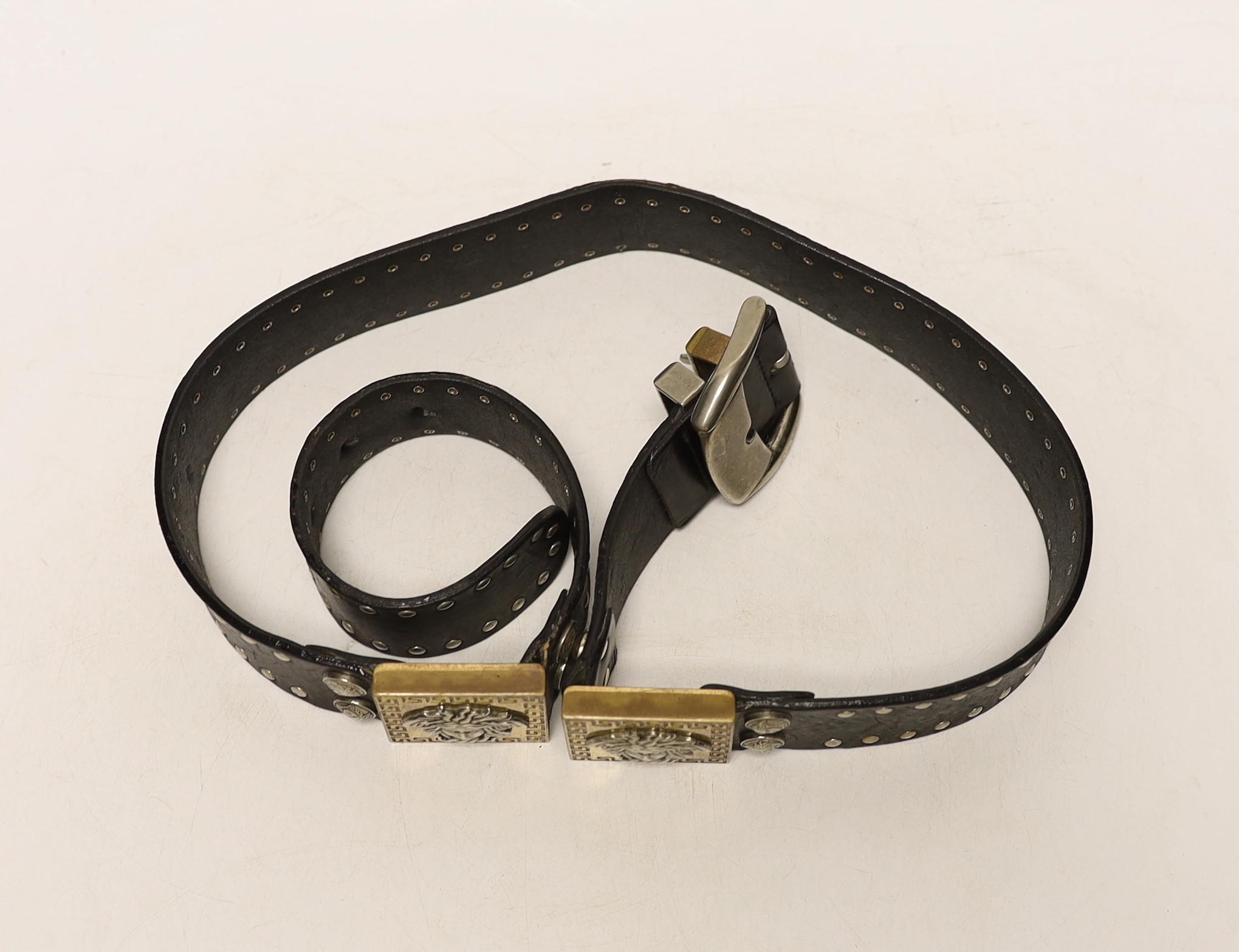A Versace black leather belt with Medusa motif mounts, 102cm excluding buckle